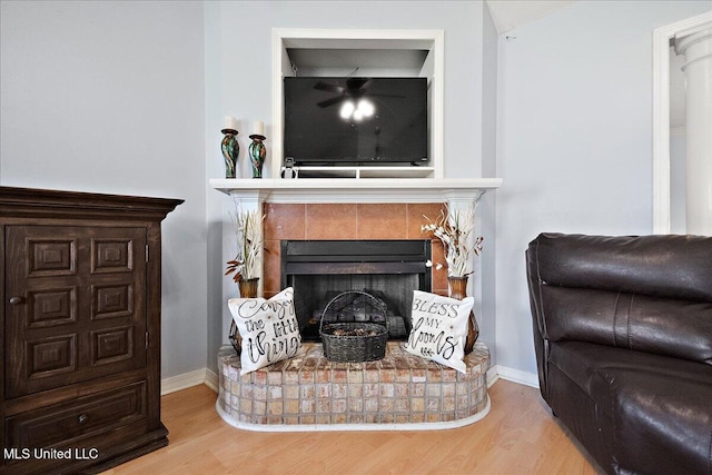 900 Redwood Cv, Byram, MS 39272 - living room featuring wood finished floors and a tiled fireplace