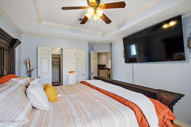 900 Redwood Cv, Byram, MS 39272 - bedroom with a raised ceiling, crown molding, ceiling fan, and connected bathroom