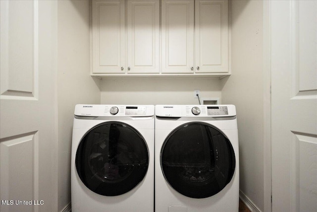 900 Redwood Cv, Byram, MS 39272 - laundry area with cabinet space and washer and clothes dryer