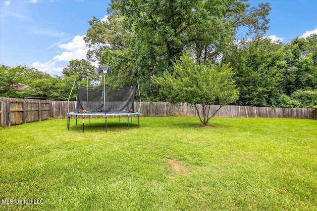 900 Redwood Cv, Byram, MS 39272 - fenced backyard with a trampoline