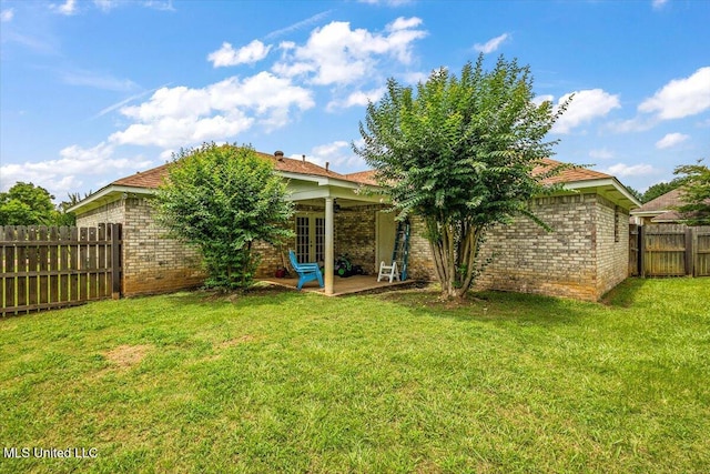 900 Redwood Cv, Byram, MS 39272 - rear view of property featuring brick siding, a fenced backyard, and a patio