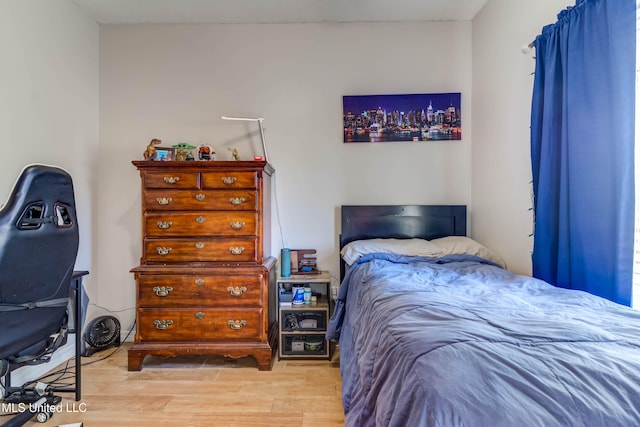 bedroom with light hardwood / wood-style flooring