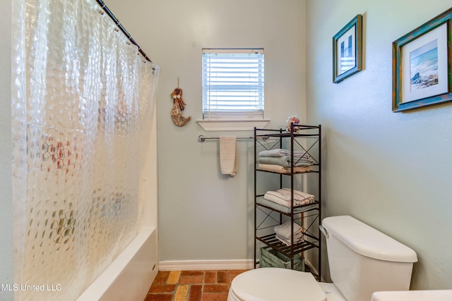 bathroom with toilet and shower / tub combo with curtain