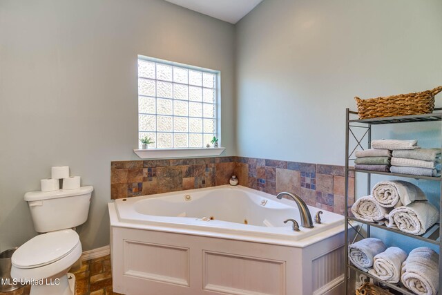 bathroom with toilet and a bathing tub