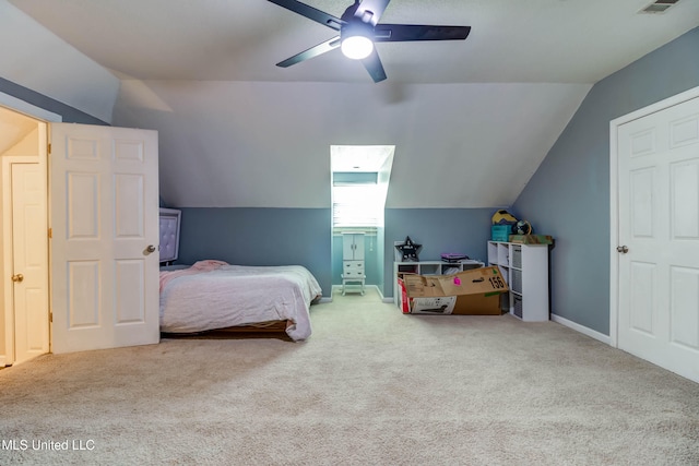 bedroom with carpet flooring, ceiling fan, and lofted ceiling