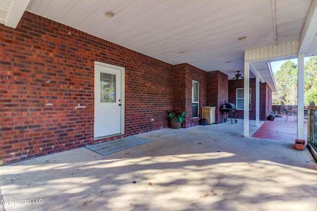 view of patio with area for grilling and ceiling fan