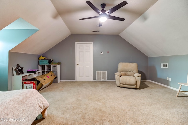 carpeted bedroom featuring ceiling fan and vaulted ceiling