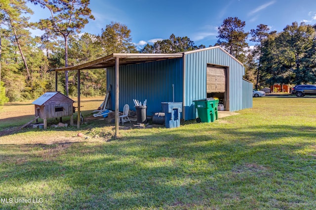 view of outdoor structure featuring a lawn and a garage