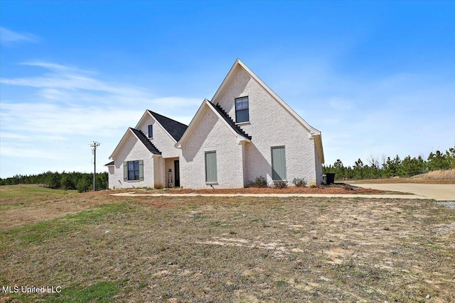 view of front of home with brick siding