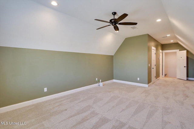 additional living space with lofted ceiling, recessed lighting, light colored carpet, visible vents, and baseboards