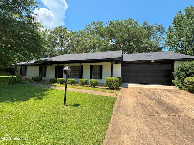 1158 Greenbriar St, Jackson, MS 39211 - single story home with an attached garage, concrete driveway, a front yard, and brick siding