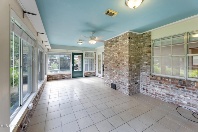 4 Briarwood Cir, Long Beach, MS 39560 - unfurnished sunroom with brick wall, tile patterned floors, and a ceiling fan