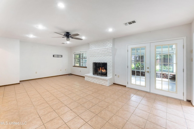 4 Briarwood Cir, Long Beach, MS 39560 - unfurnished living room featuring french doors, a ceiling fan, recessed lighting, and a brick fireplace