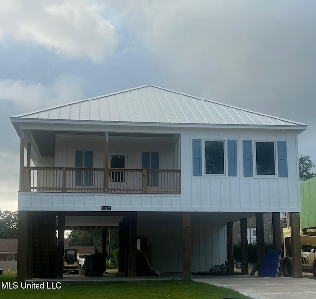 exterior space with a balcony and a carport