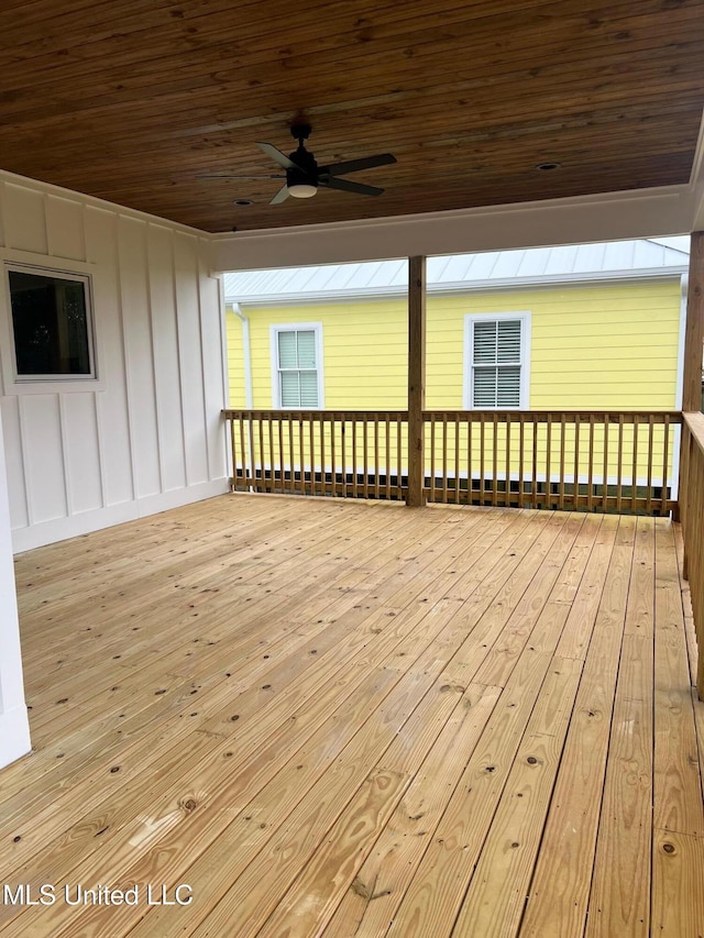 wooden terrace featuring ceiling fan