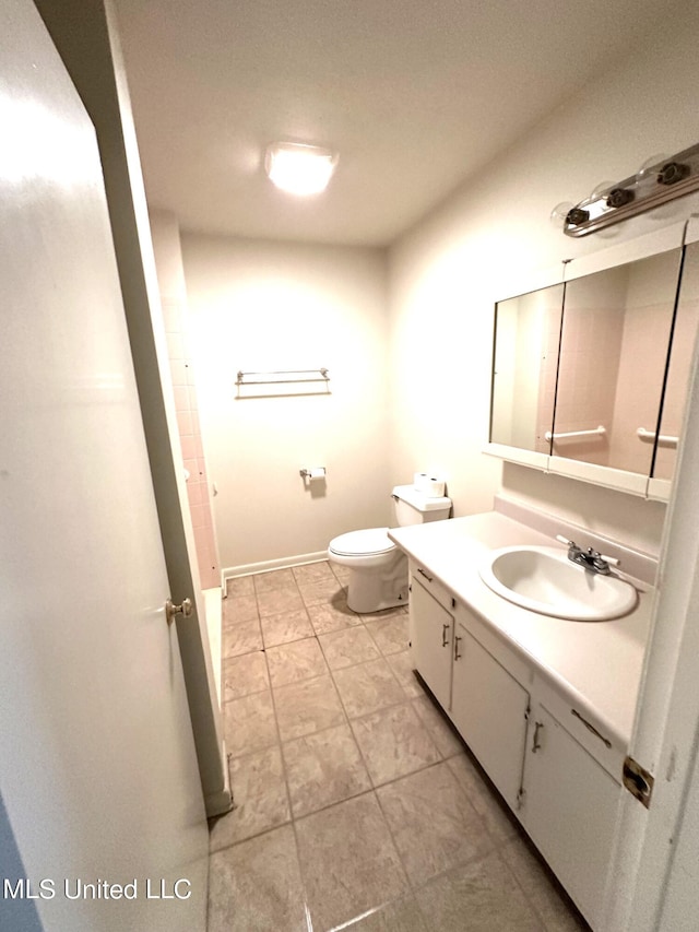 bathroom with toilet and vanity