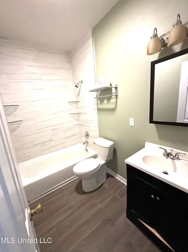 full bathroom featuring vanity, toilet, hardwood / wood-style flooring, and tiled shower / bath