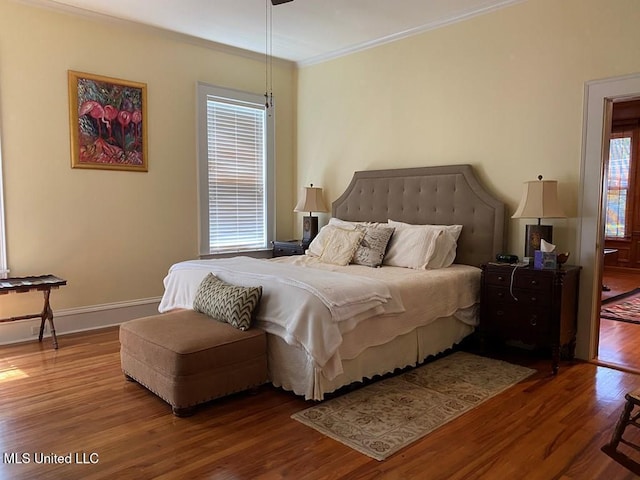 125 Riverside St, Vidalia, LA 71373 - bedroom with ornamental molding, wood finished floors, and baseboards