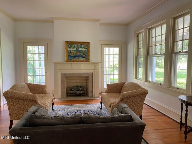 125 Riverside St, Vidalia, LA 71373 - sitting room with ornamental molding, wood finished floors, a high end fireplace, and baseboards