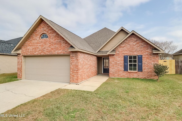 view of front of home with a garage and a front lawn