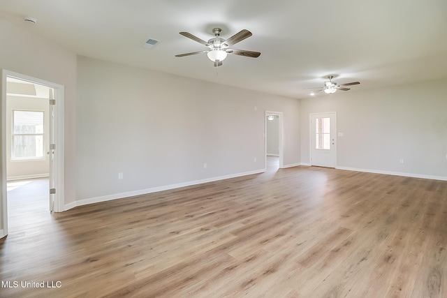 spare room with ceiling fan and light hardwood / wood-style floors