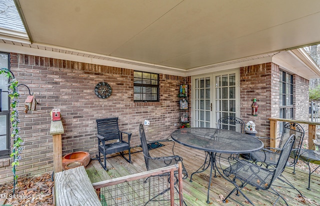 deck with outdoor dining area