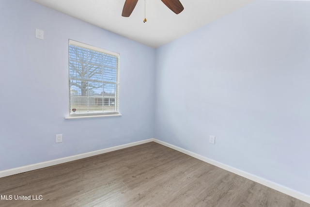 unfurnished room featuring hardwood / wood-style flooring and ceiling fan