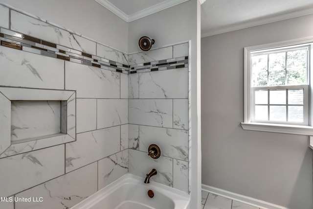 bathroom with tiled shower / bath and crown molding