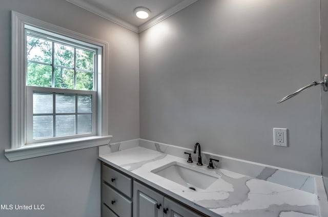 bathroom featuring vanity and crown molding