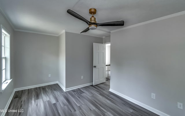 spare room featuring ceiling fan, hardwood / wood-style flooring, and ornamental molding