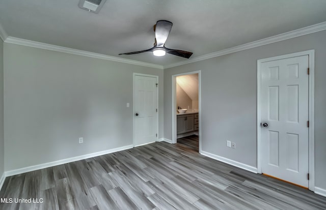 unfurnished bedroom with light hardwood / wood-style flooring, crown molding, and ceiling fan