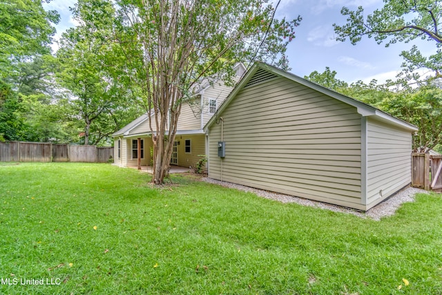 exterior space with a yard and a patio area