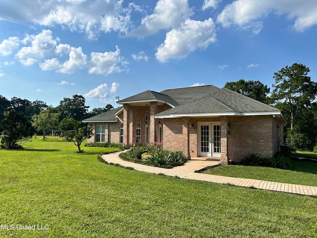 single story home featuring french doors and a front lawn