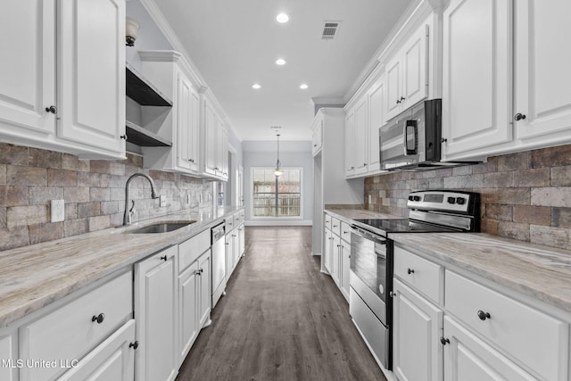 kitchen with stainless steel appliances, white cabinetry, a sink, and open shelves