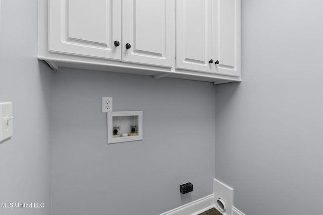 washroom featuring hookup for a washing machine, cabinet space, hookup for an electric dryer, and baseboards