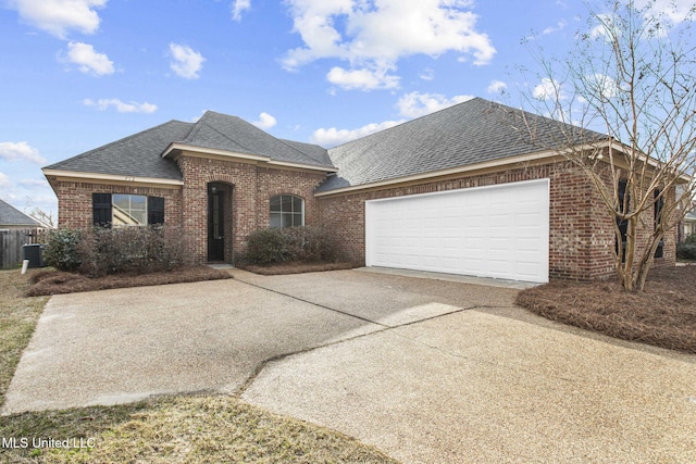 view of front facade featuring an attached garage, driveway, roof with shingles, and brick siding