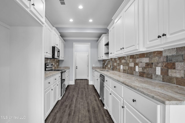 kitchen featuring crown molding, appliances with stainless steel finishes, a sink, and white cabinets