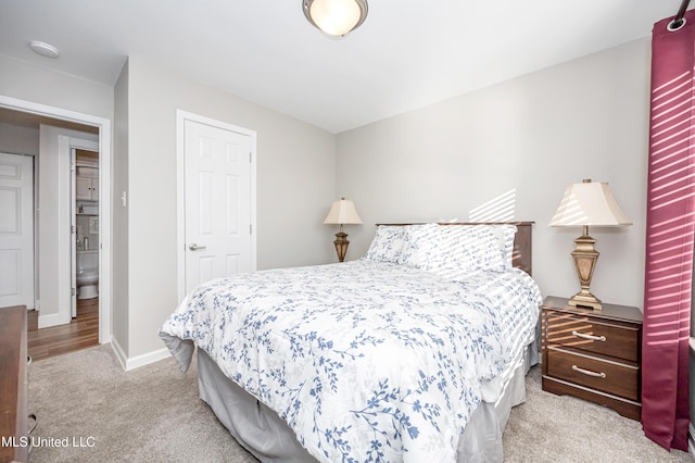 2421 Beachview Dr Unit F16, Ocean Springs, MS 39564 - bedroom with a closet, baseboards, and light carpet