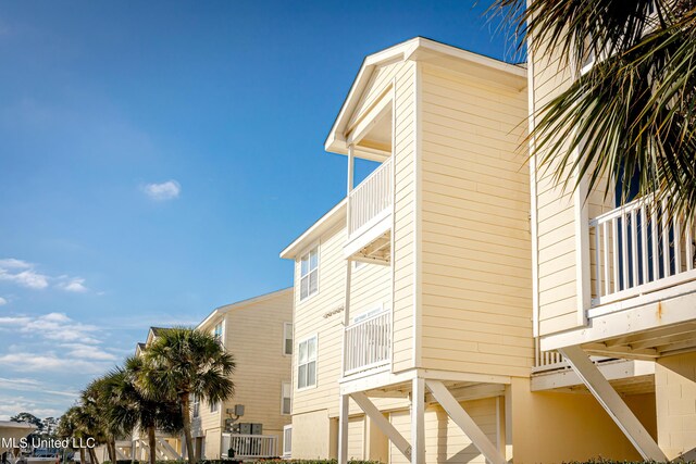 2421 Beachview Dr Unit F16, Ocean Springs, MS 39564 - view of side of home with a carport and a balcony