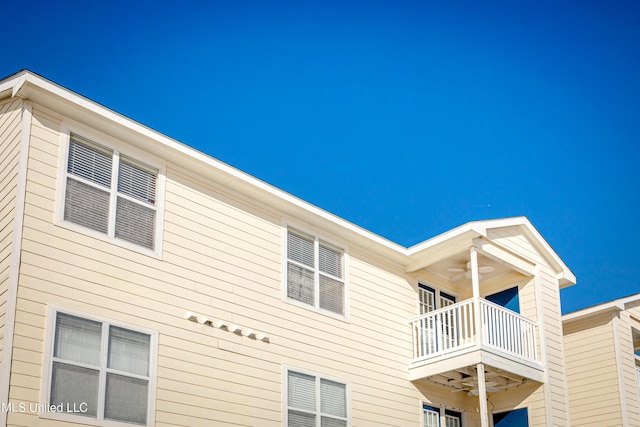 2421 Beachview Dr Unit F16, Ocean Springs, MS 39564 - view of property exterior featuring a ceiling fan and a balcony