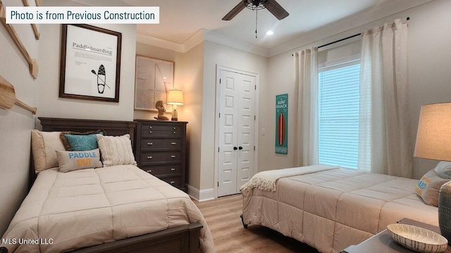 220 W Ave, Long Beach, MS 39560 - bedroom with light wood-type flooring, crown molding, a ceiling fan, a closet, and baseboards