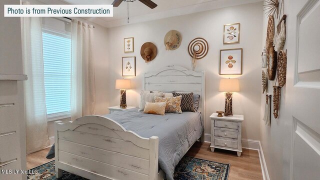 220 W Ave, Long Beach, MS 39560 - bedroom featuring wood finished floors, baseboards, and a ceiling fan