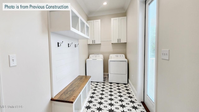 220 W Ave, Long Beach, MS 39560 - washroom featuring cabinet space, light flooring, washing machine and clothes dryer, ornamental molding, and baseboards