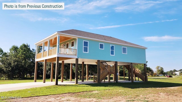 220 W Ave, Long Beach, MS 39560 - rear view of house with a carport, a yard, stairs, and a shingled roof