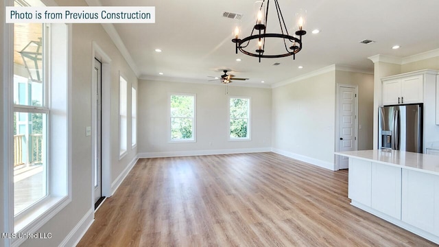 220 W Ave, Long Beach, MS 39560 - unfurnished dining area with a chandelier, baseboards, crown molding, recessed lighting, and light wood-style floors