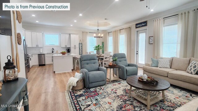 220 W Ave, Long Beach, MS 39560 - living room featuring light wood-style floors, recessed lighting, ornamental molding, and ceiling fan