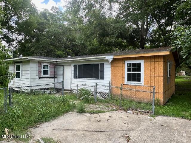11196 Dewey Lawrence Cir, Diberville, MS 39540 - ranch-style home with a fenced front yard