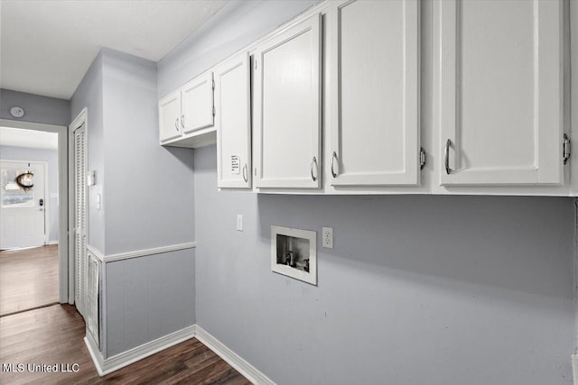 laundry area with dark hardwood / wood-style flooring, hookup for a washing machine, and cabinets