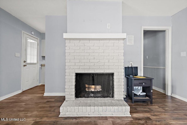 room details with hardwood / wood-style flooring and a fireplace