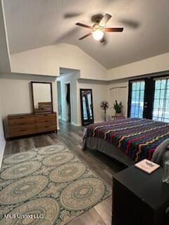 bedroom featuring hardwood / wood-style floors, ceiling fan, lofted ceiling, and french doors